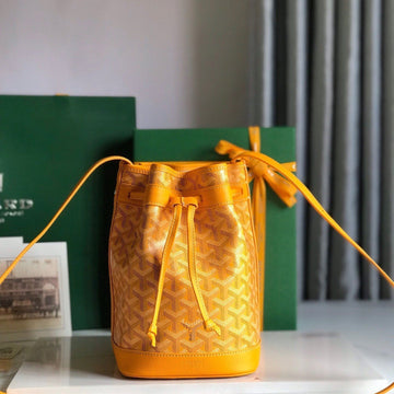 PETIT FLOT BUCKET BAG 22 IN YELLOW GOYARDINE CANVAS AND LAMBSKIN TRIM Luxe Carry Bags